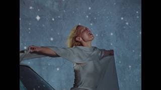 Still from the video for “Stop The Wedding!” by Ashe