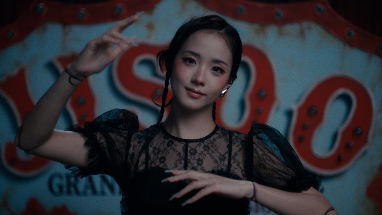 JISOO 'CLICK' MV capture: JISOO in a black lace top with puffed sleeves and braided pigtails raises one hand in front of a rusted, red-lettered carnival sign